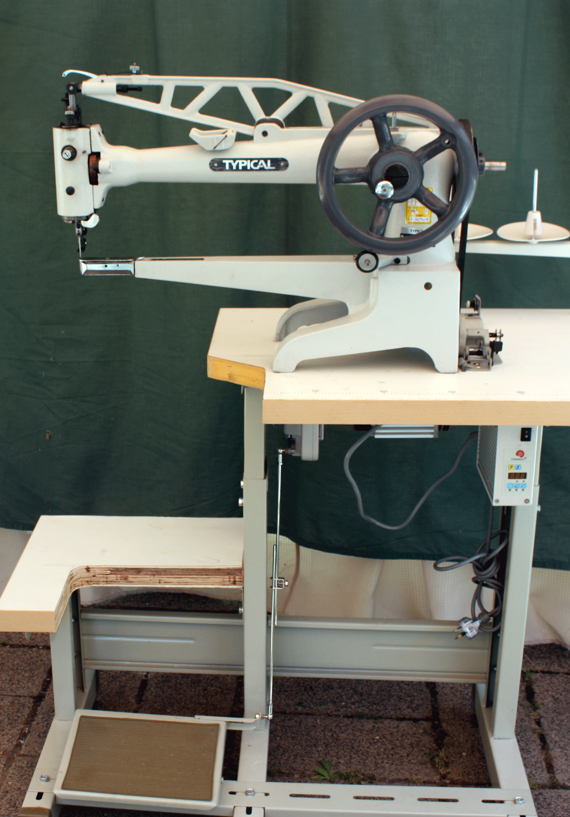 Typical boot patch machine with long arm complete on bench with servo motor